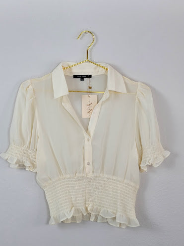 Blusa abotonada color blanco roto