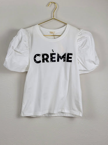 Blusa blanca con mangas abullonadas color crema